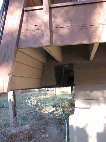 The home's wall cantilevers over the foundation by at least 6 inches.